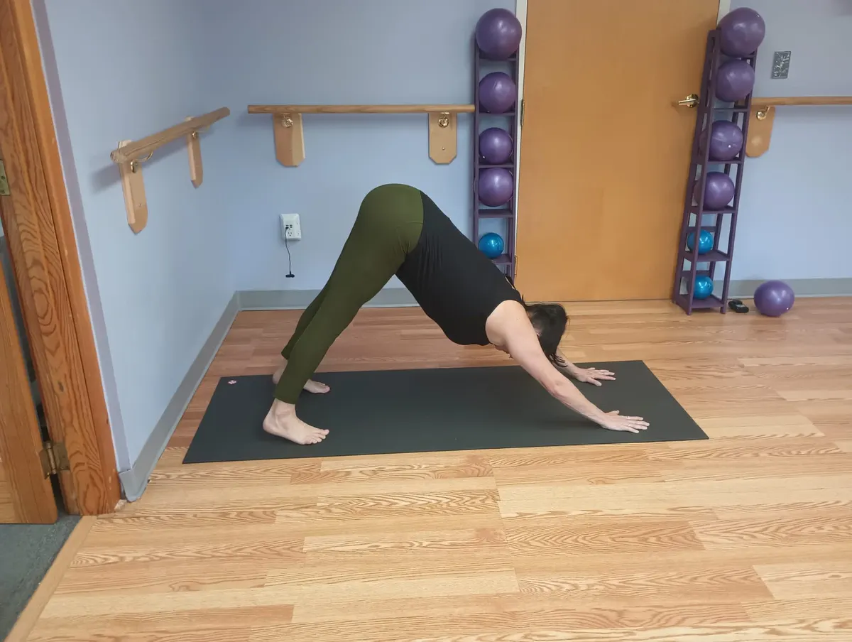 Downward facing dog in the studio